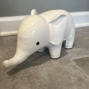 Züny white leather elephant. Can be used as a door stop, bookend or decoration.